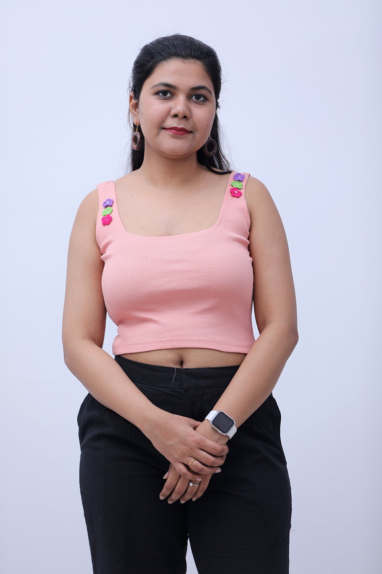 Pink ribbed tank top with crochet flowers
